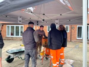 Resins R Us students learning about mixing resin-bound to become resin-bound approved installers